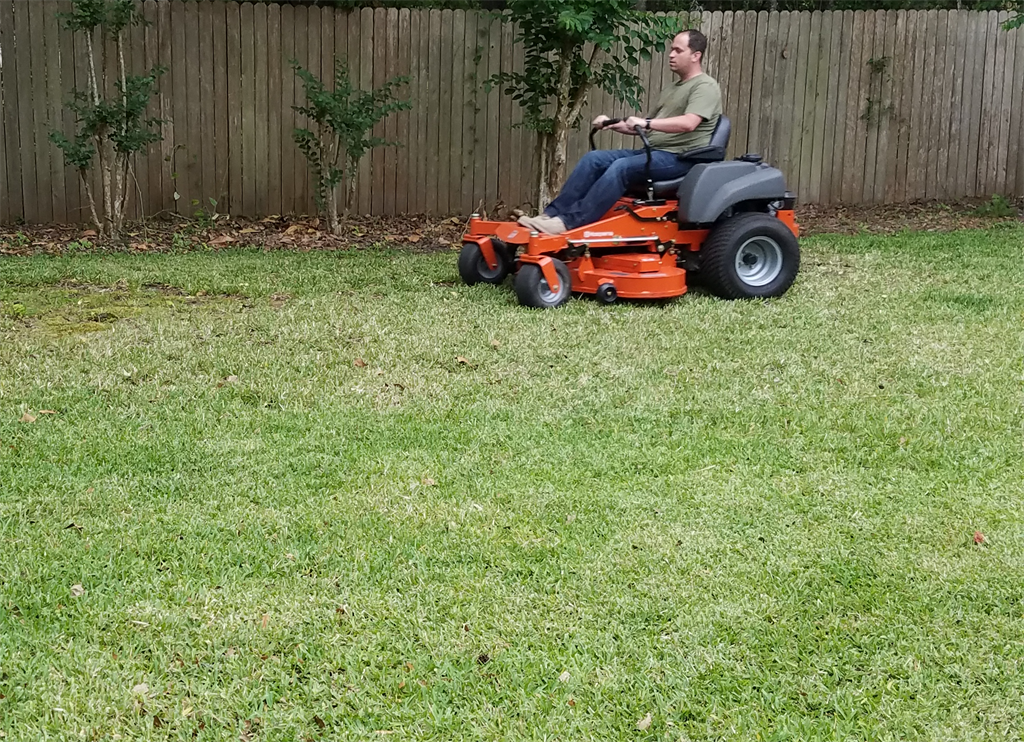 The owner mowing the lawn in St Augustine and St Johns County